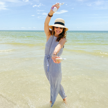 Denice Duff posing on a beach and smiling