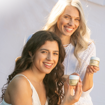 mature woman and young woman holding CREAMs