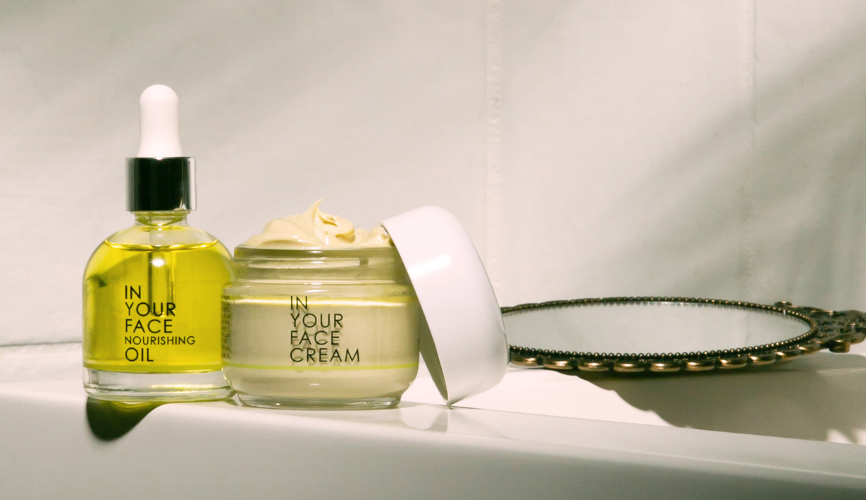 nourishing oil and CREAM with a pretty mirror beside them
