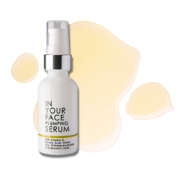 an image of IN YOUR FACE PLUMPING SERUM with a smear behind it