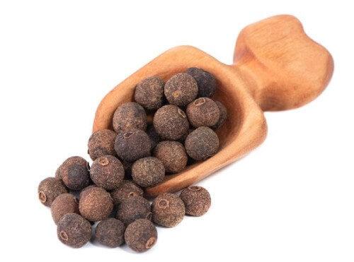 image of allspice nuggets in a wooden spoon