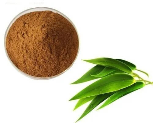 an image of a brown powder in a dish with green leaves