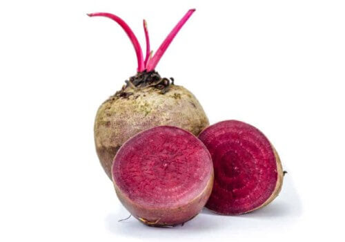 an image of 2 beets with one cut open