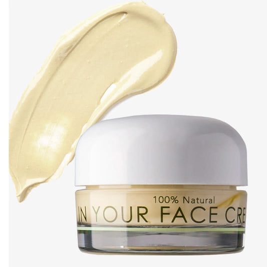 Jar of 'In Your Face Cream' with a swatch of cream on a white background