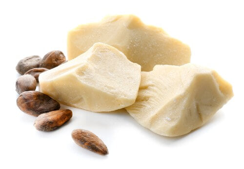 cocoa butter and beans on a white background