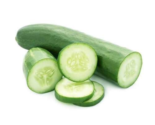sliced cucumber on a white background