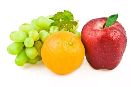 an image for lactic acid: grapes, an orange and a red apple