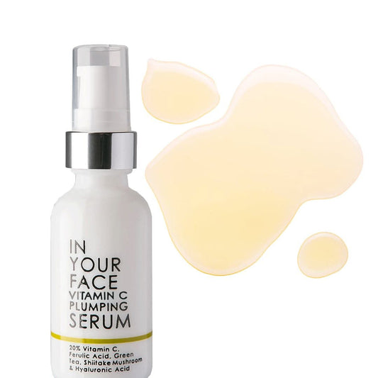 vitamin c plumping serum on a white background with smear