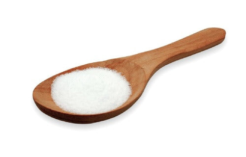 an image of white crystalline powder on a spoon
