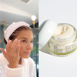 a woman applying EYE GEL under her eyes.