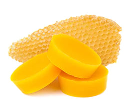 sliced beeswax on white background