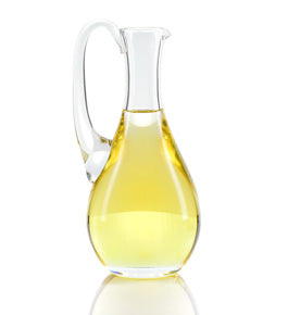 carafe of yellow clear liquid for Castile Soap