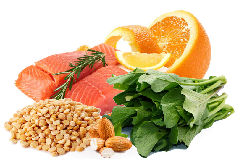 salmon, seeds, spinach, orange on white background