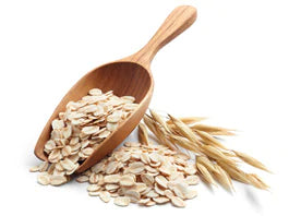 cereal grains and scooper on white background