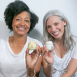 2 mature women holding jars of THE CREAM and MARINE PEARL CREAM