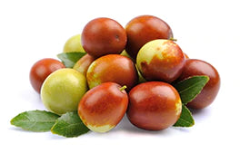 a pile of jojoba fruit on white background