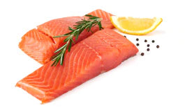 salmon with rosemary and lemon on white background