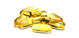vitamin E capsules on white background