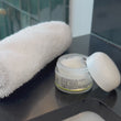 woman showing how to apply the EYE GEL