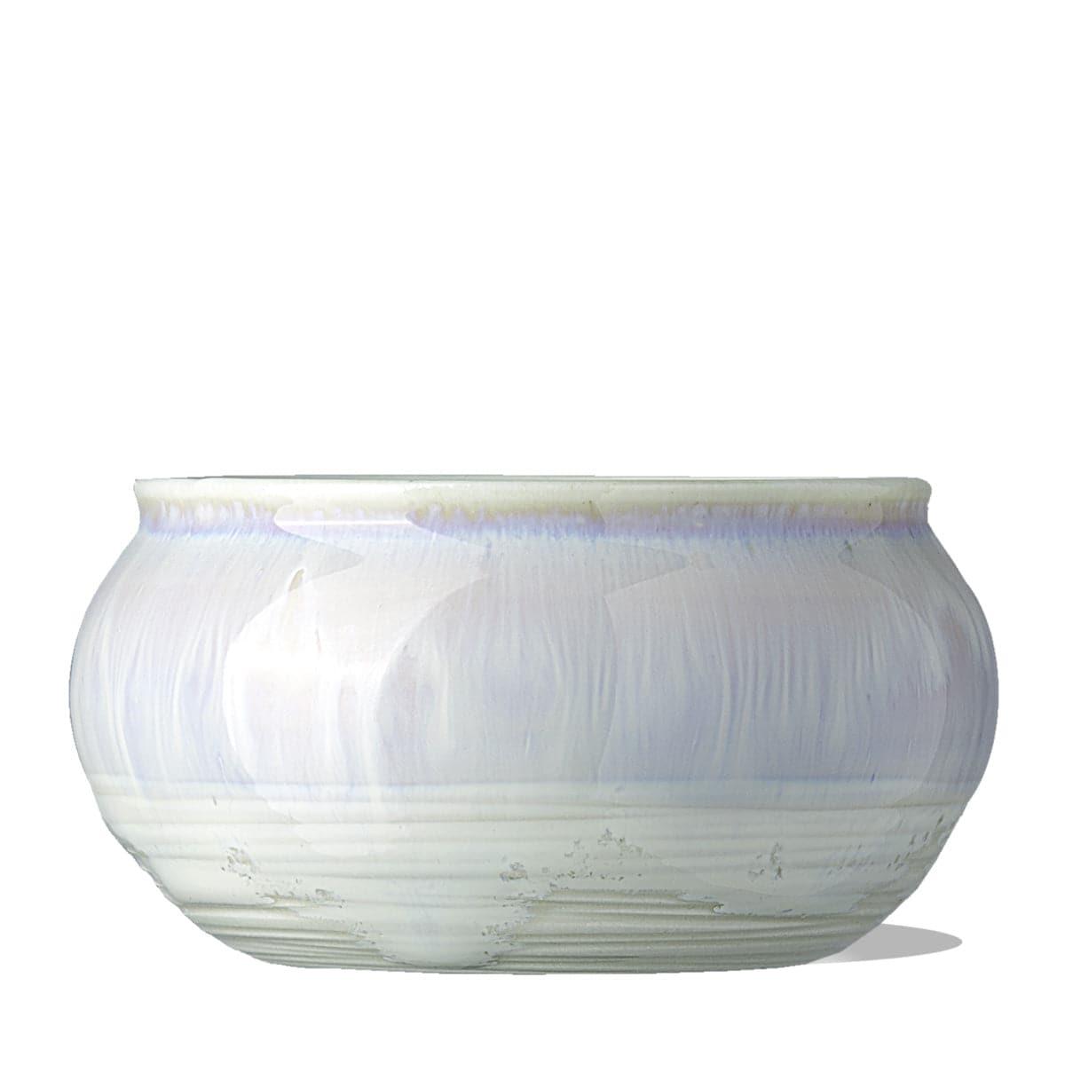 a clean shot of the IN YOUR FACE BOWL, a porcelain, artisan-made ceramic treatment bowl. It is an iridescent white color.