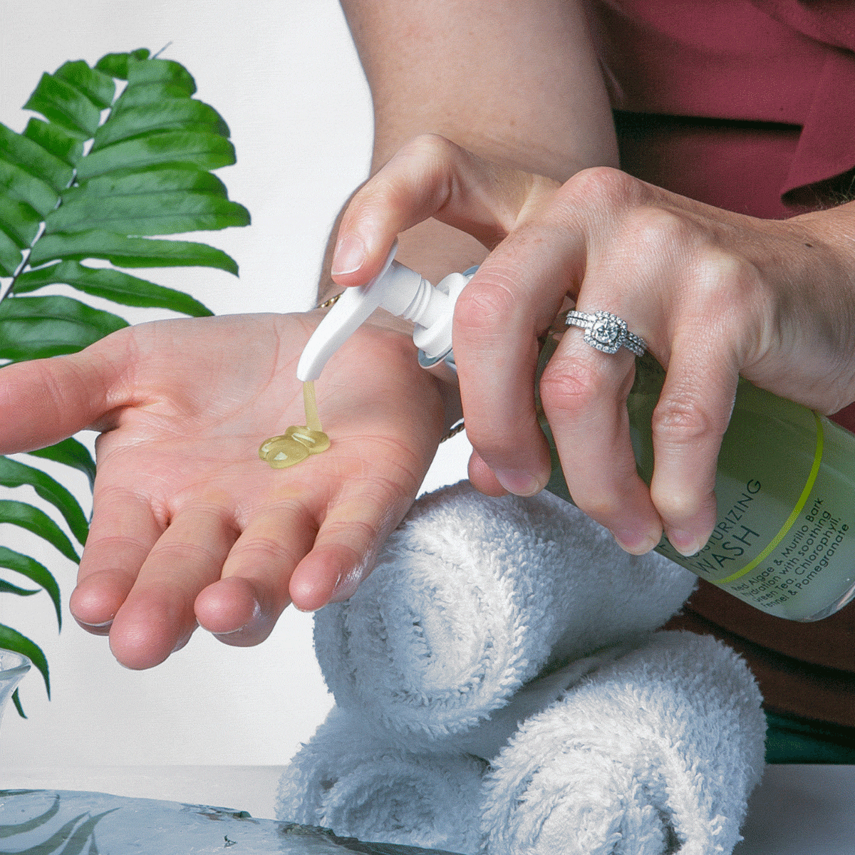 an image of IN YOUR FACE MOISTURIZING WASH being pumped into a palm.