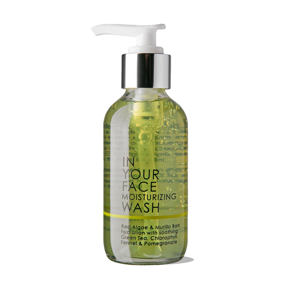 A photo of the IN YOUR FACE MOISTURIZING WASH on a white background. The bottle shows the wash inside to be a medium green color. The bottle also says "Red Algae & Murillo Bark hydration with soothing Green Tea, Chlorophyll, Fennel & Pomegranate".