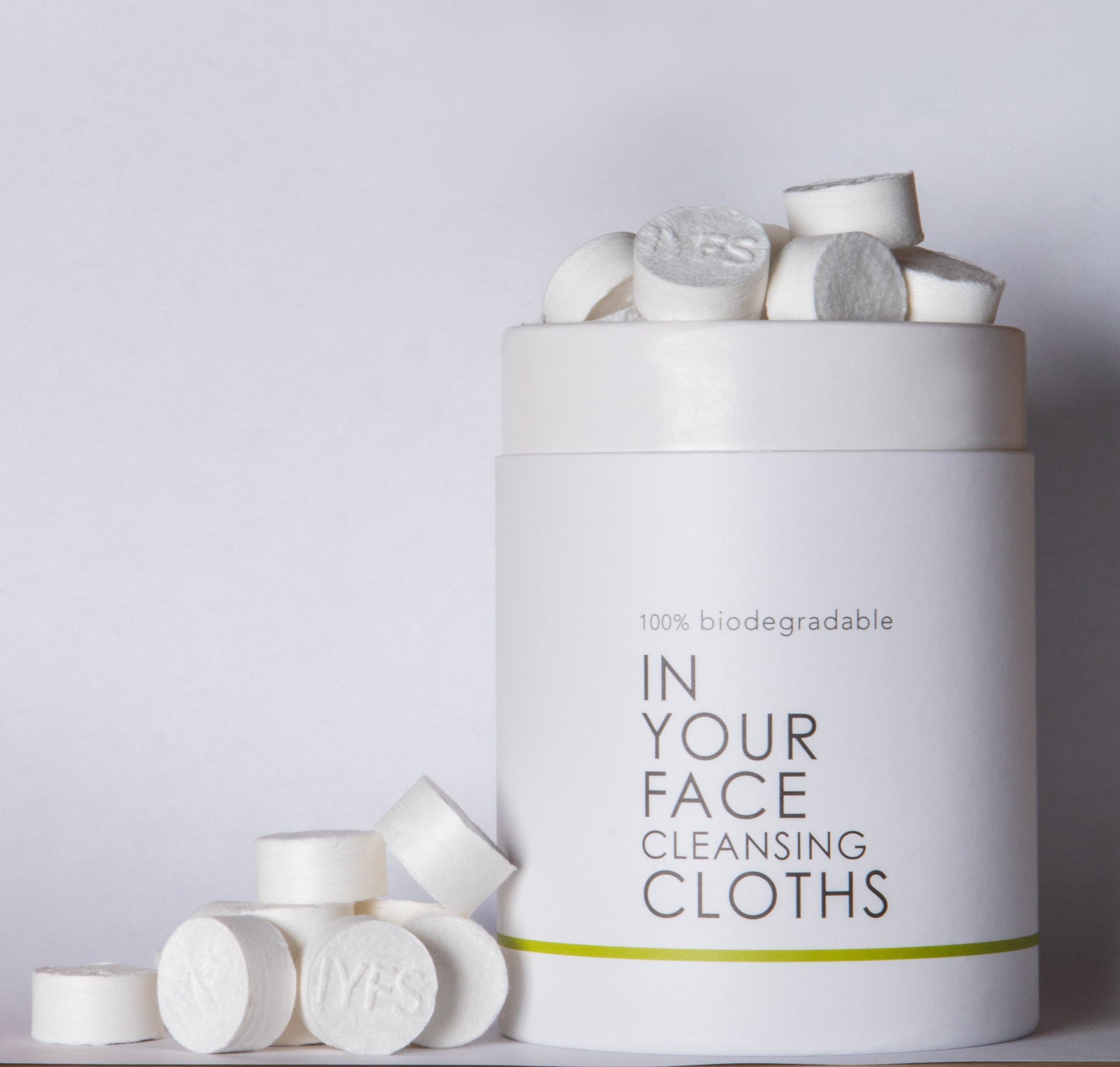 tube of CLEANSING CLOTHS on a grey background.