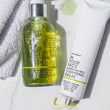 the DOUBLE CLEANSE DUO next to a towel on marble.