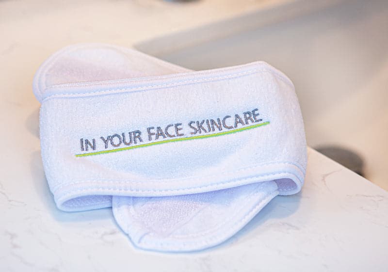 an image of the IN YOUR FACE SKINCARE velcro hair wrap on a marble countertop