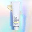 MANDARIN MELT CLEANSING BALM on holographic background.