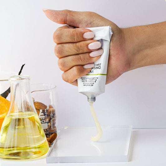 A tube of the CLEANSING BALM folded in half.
