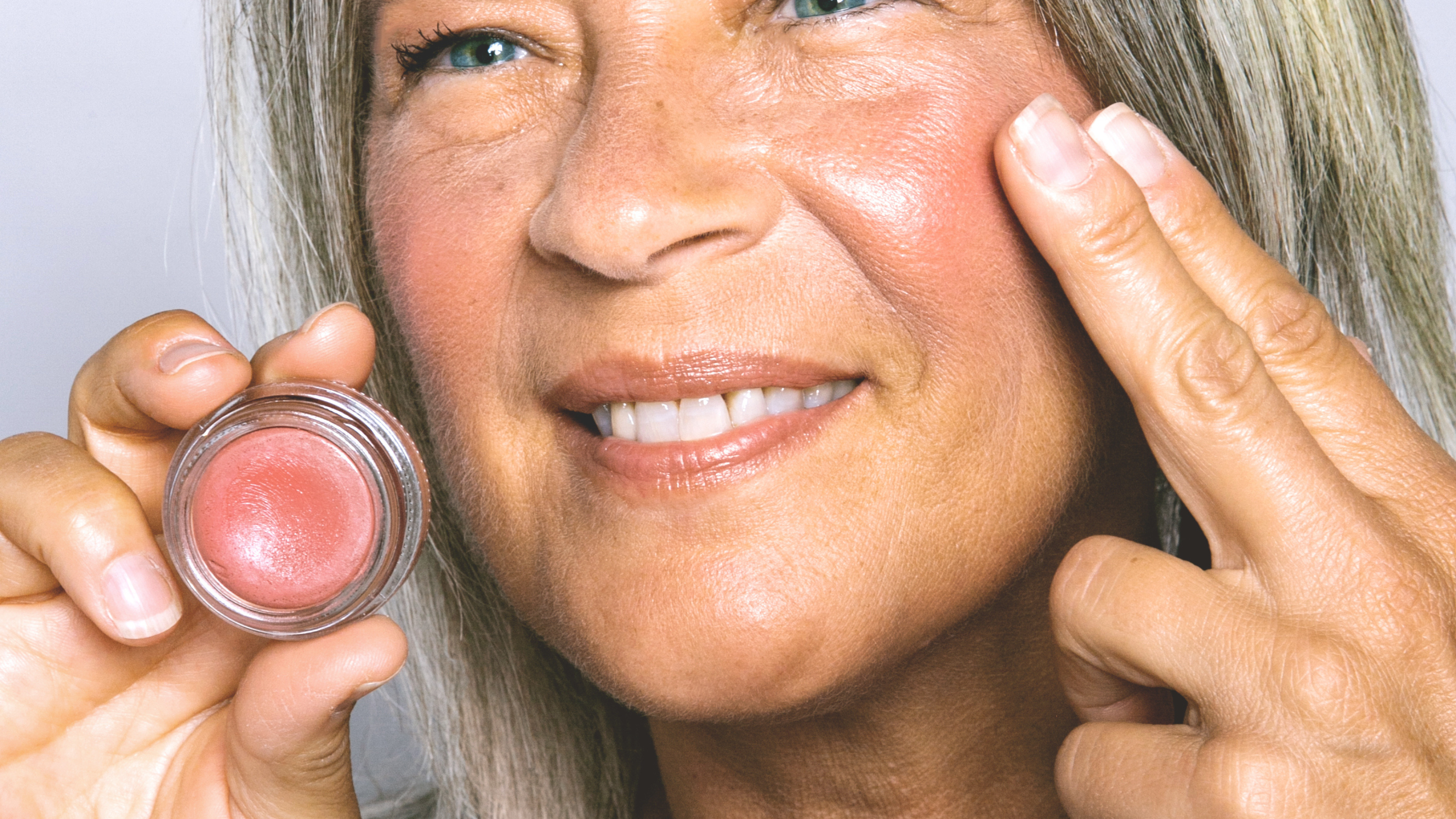 pretty, mature woman applying COLOR