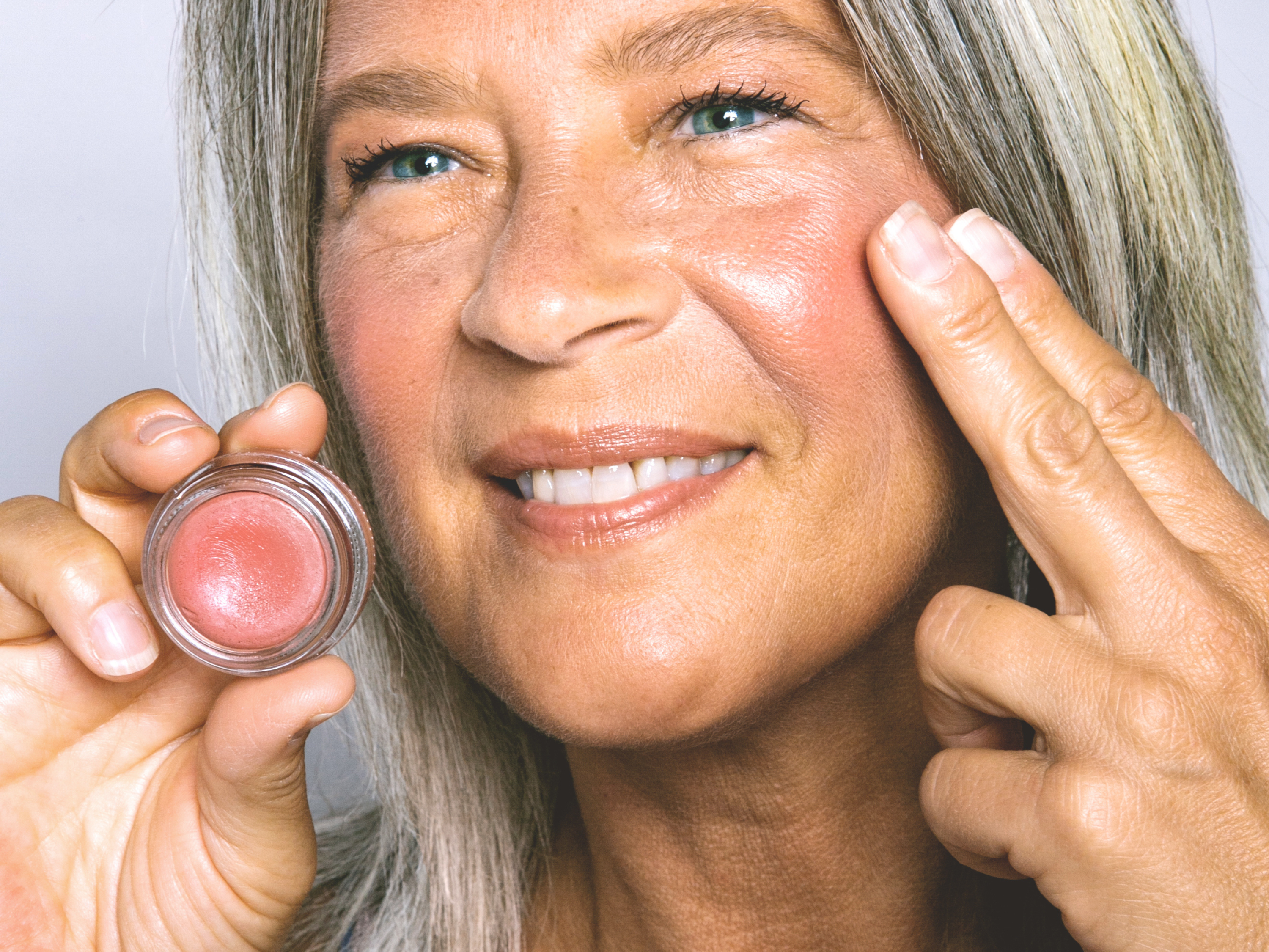 pretty, mature woman applying COLOR