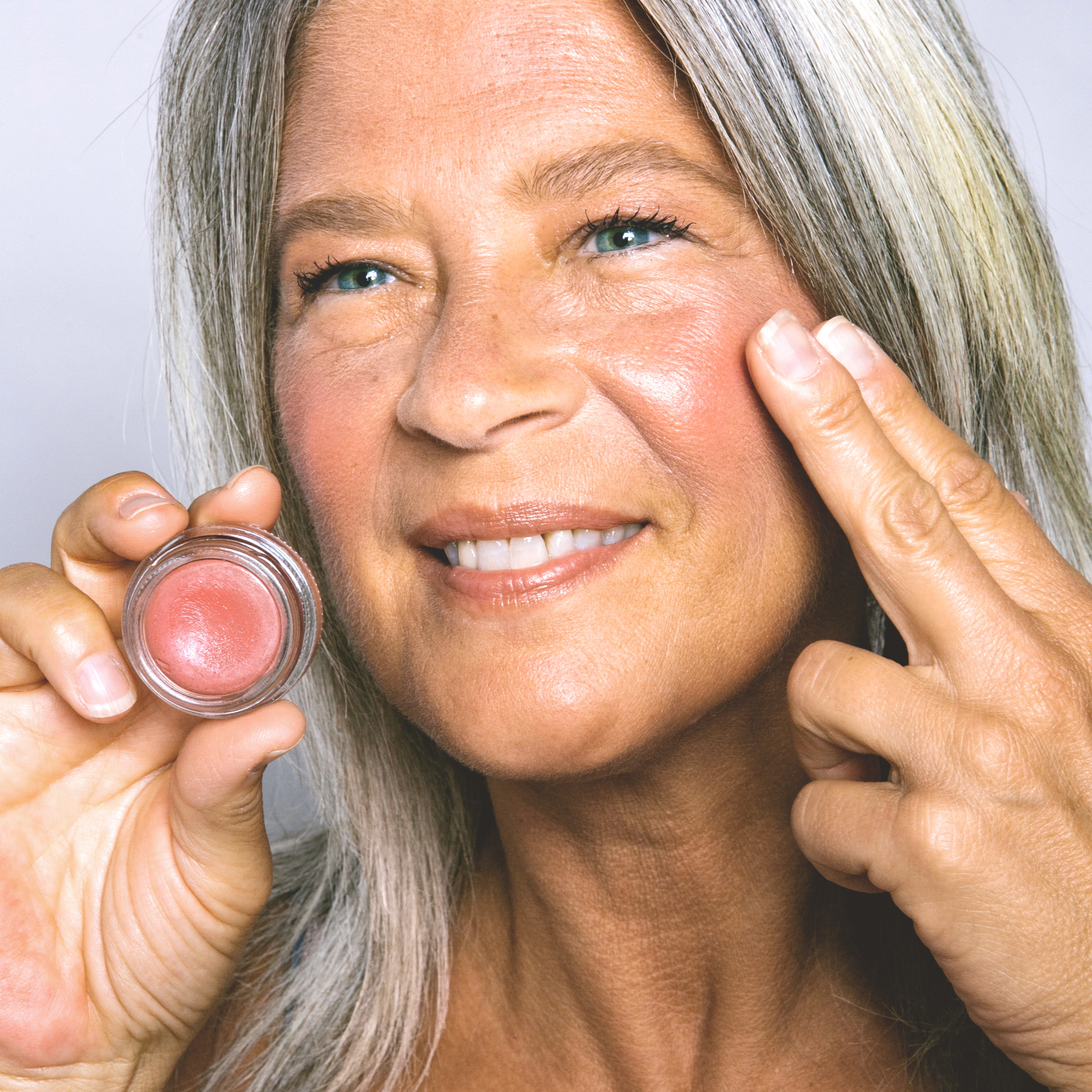 pretty, mature woman applying COLOR