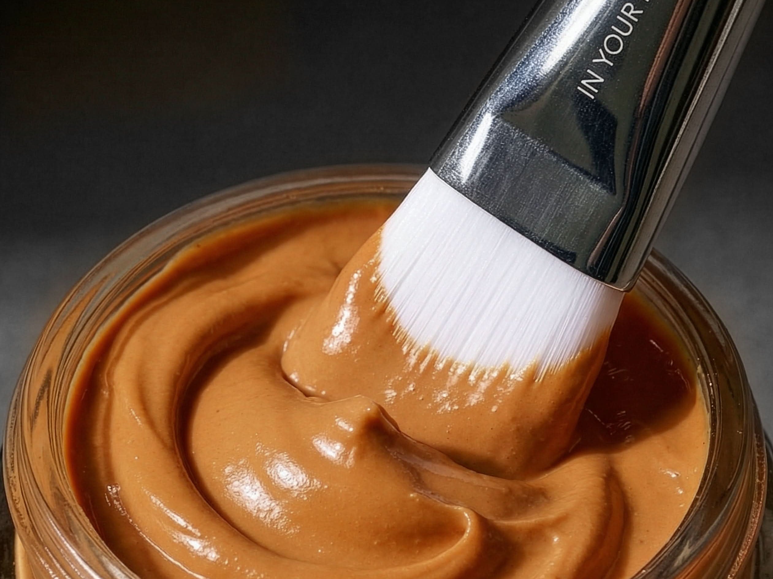 IMage of brush in open Pumpkin Mask Jar with mask on brush