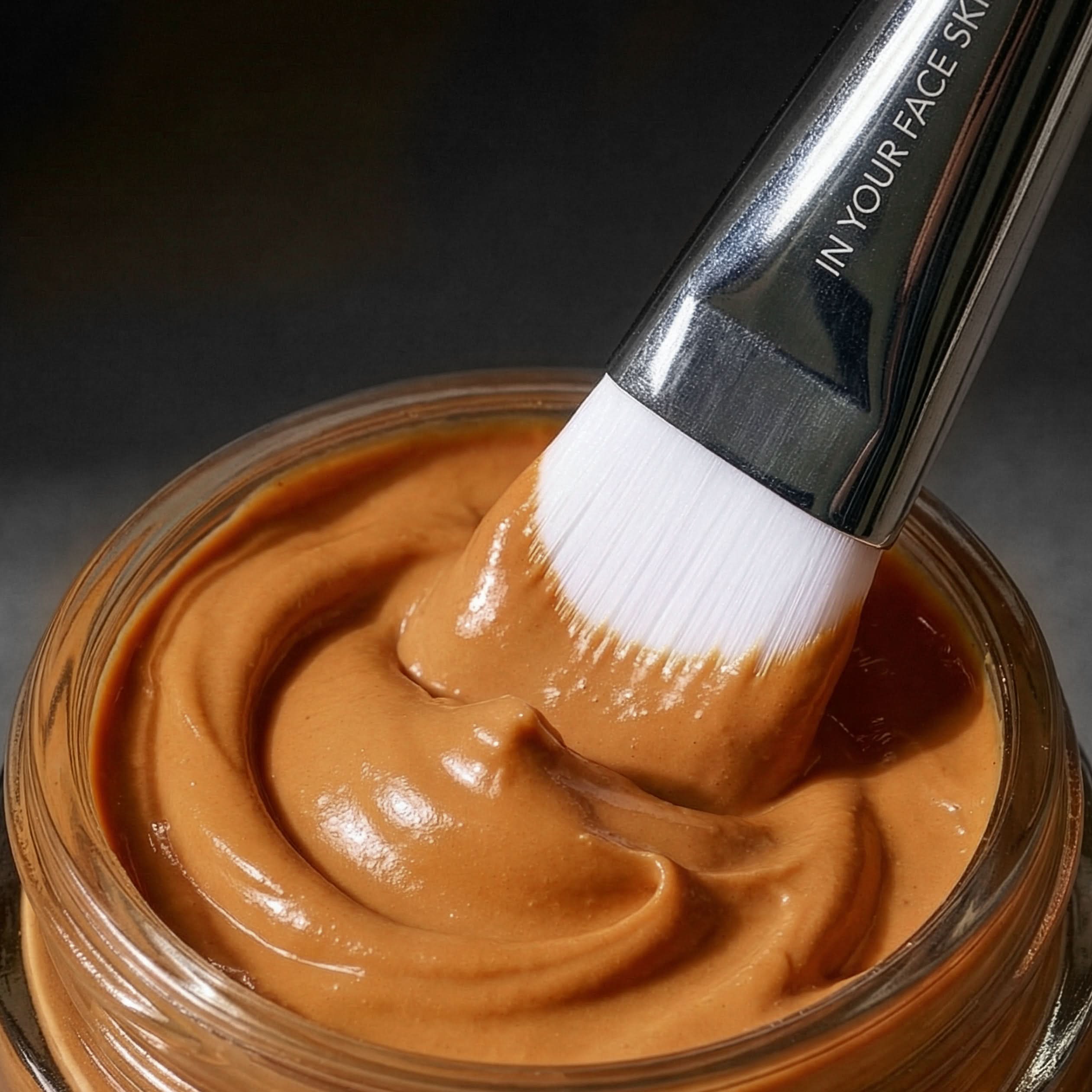 IMage of brush in open Pumpkin Mask Jar with mask on brush