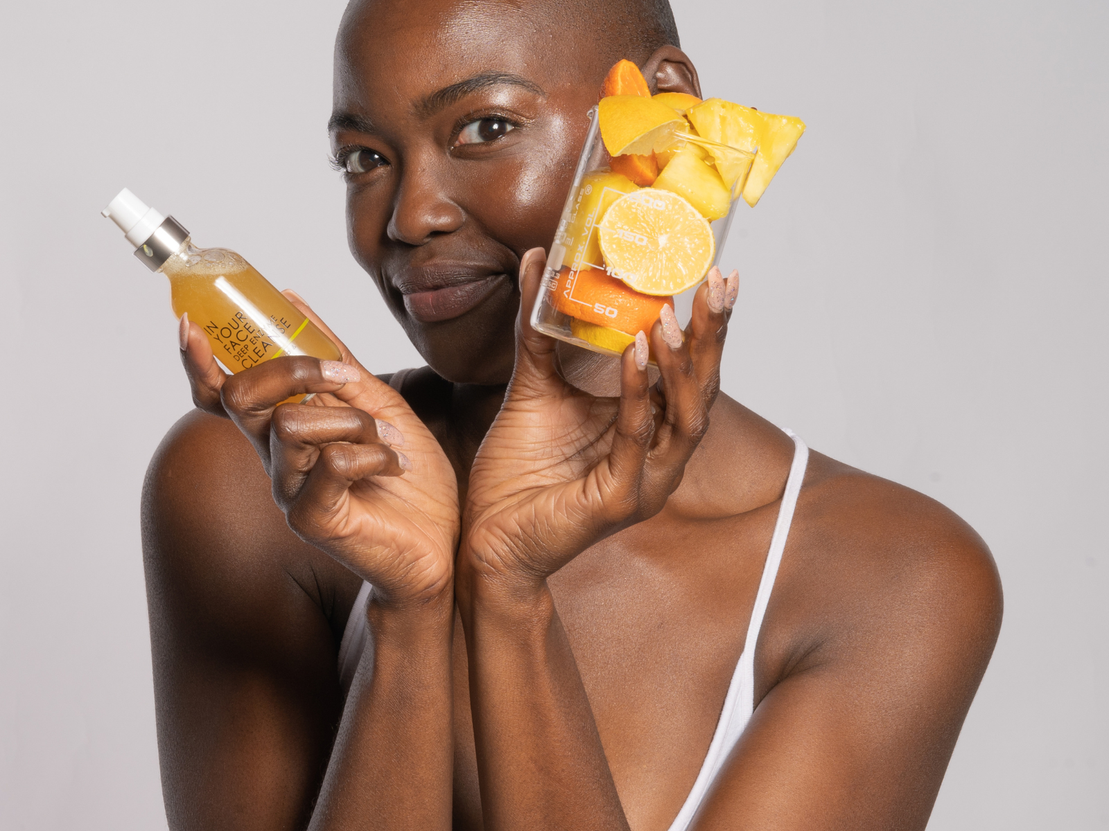 young black woman holding the DEEP ENZYME CLEANSE