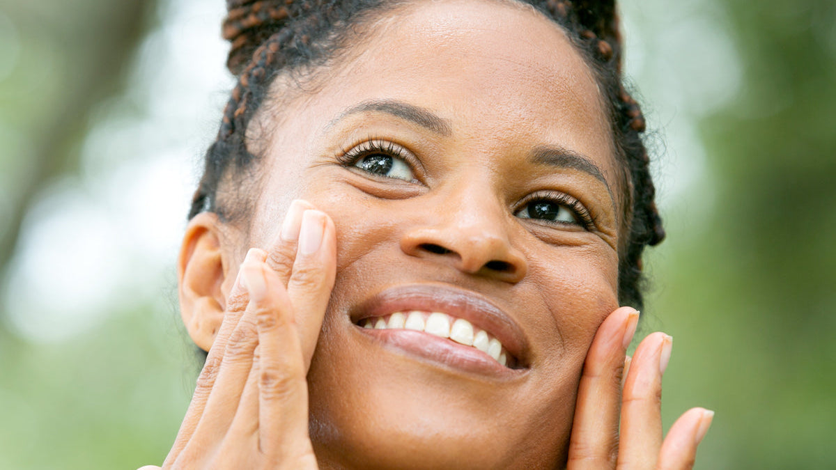 woman with hands on sides of face