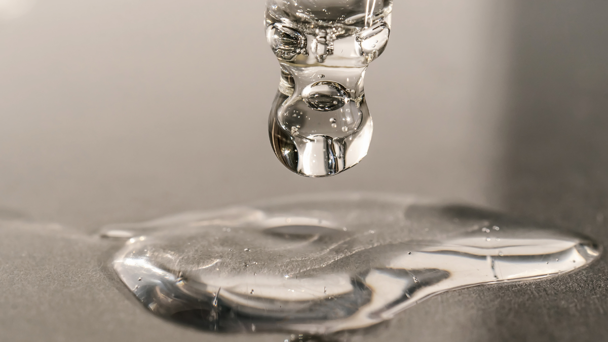 pipette of serum being poured on a surface