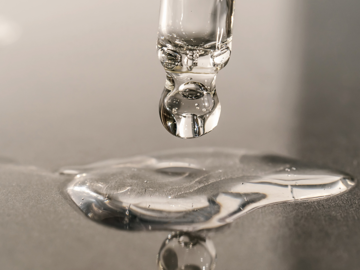 pipette of serum being poured on a surface