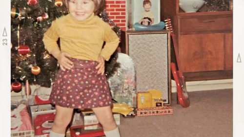 Faded old photo of very young girl at Christmas with "Denice 1969 Long Island, NY" on it
