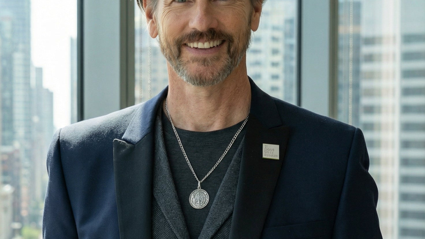 CEO Michael Duff stands in window of city highrise