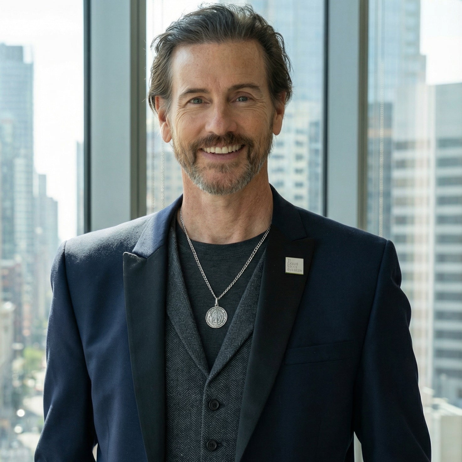 CEO Michael Duff stands in window of city highrise