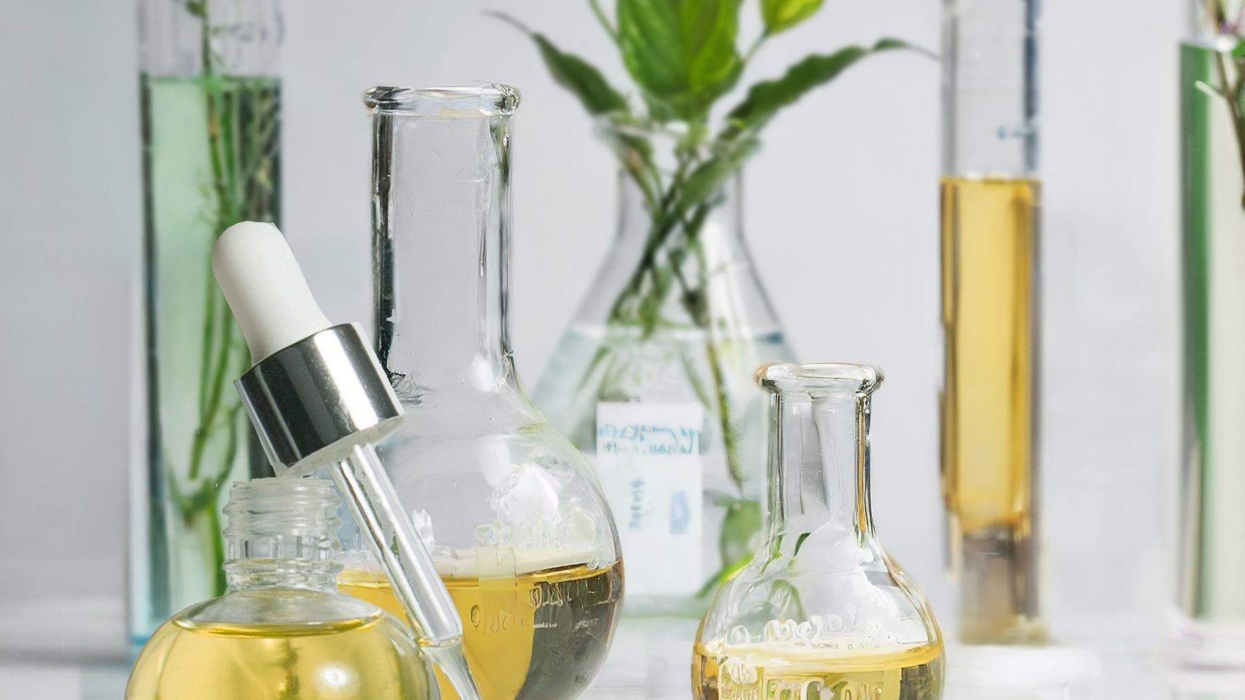NOURISHING OIL surrounded by beakers of oil