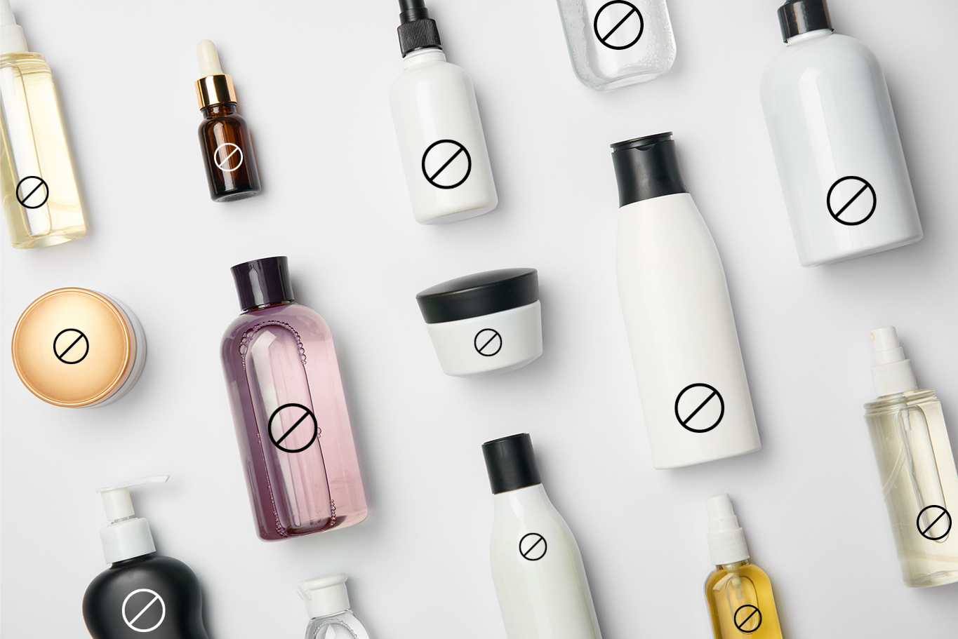 cosmetic bottles laying flat on a white surface