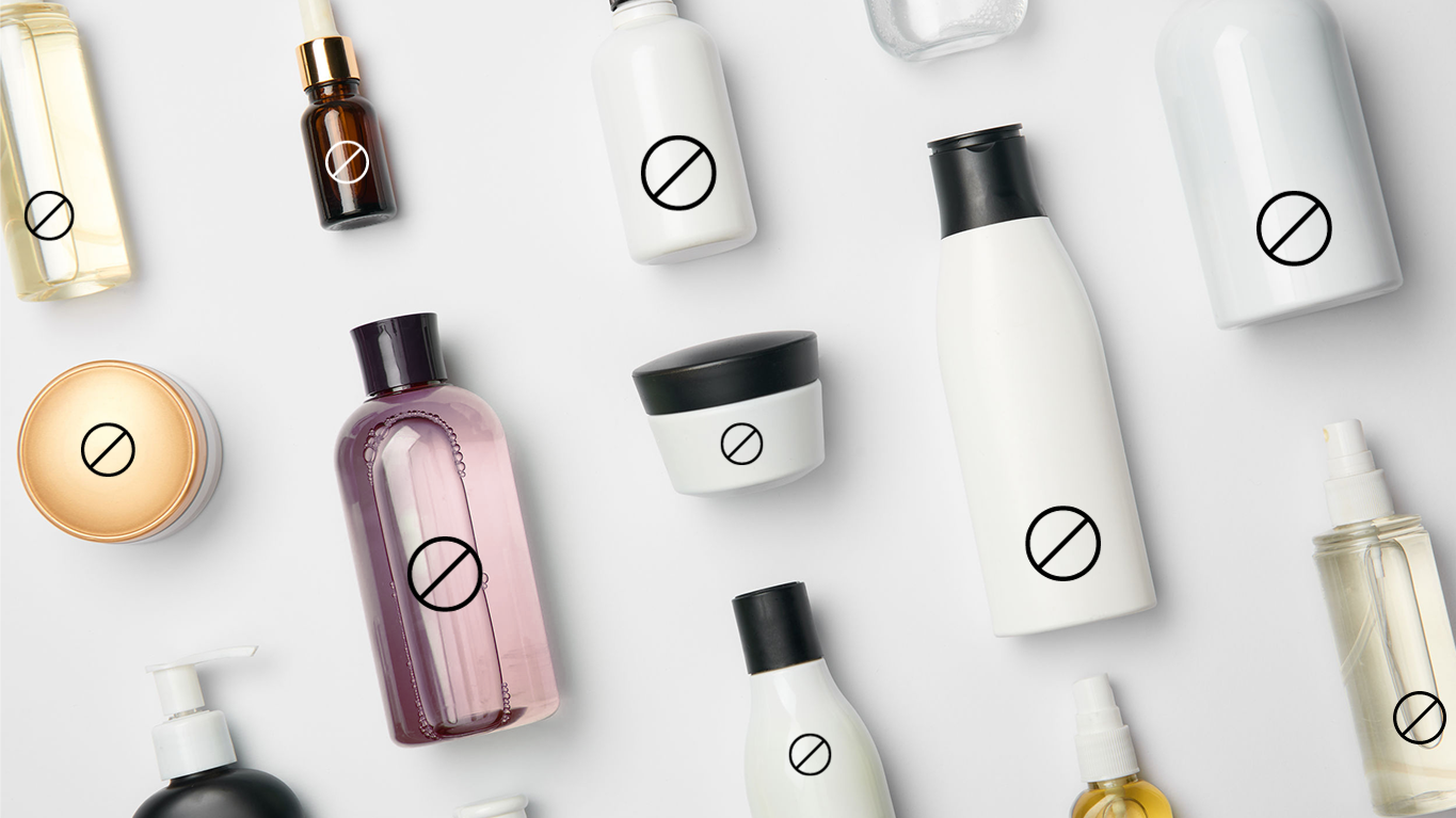 cosmetic bottles laying flat on a white surface