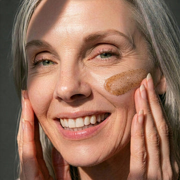 woman applying BAMBOO REFINING POLISH to face