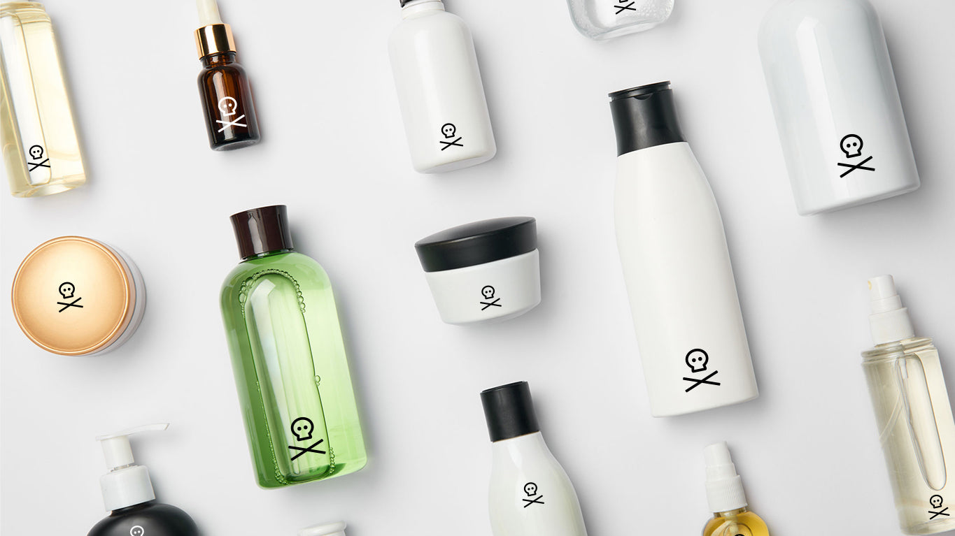 an image of cosmetic bottles with a skull and crossbones symbol on each on a white background