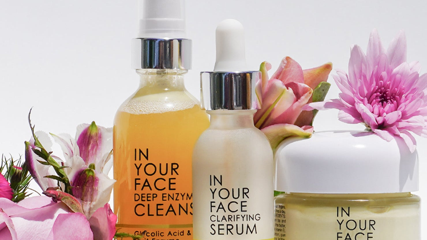 Image of products and flowers against white background