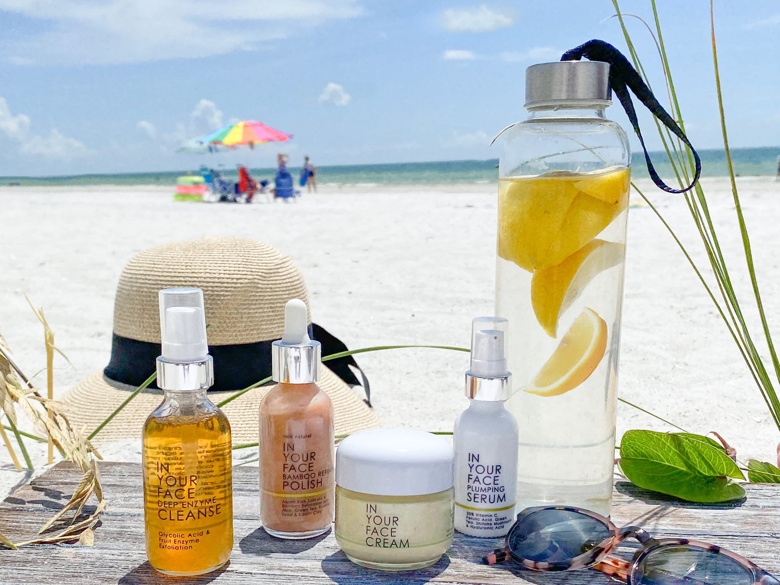 skincare products on the beach on wood
